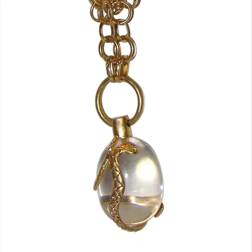 Vintage golden Snake wrapped around an elongated oval crystal